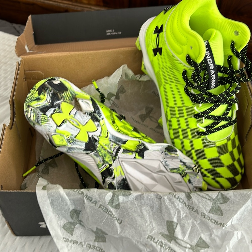 NIB football cleats. UA. Size 4